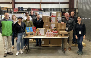 South Jersey Industries workers with some of the food collected.