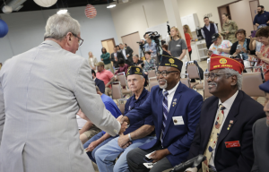 Gov. Phil Murphy meets with veterans at the ceremony for the opening of the new Veterans Service Office.